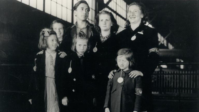 In this May 26, 1946, photo, Ginger Lane, bottom right, and her siblings arrive in New York City as Holocaust survivors who were hidden in a fruit orchard near Berlin by non-Jews. Their mother was killed at the death camp at Auschwitz. Lane has since made it her lifelong mission to educate others of this painful past. (Courtesy Ginger Lane via AP)