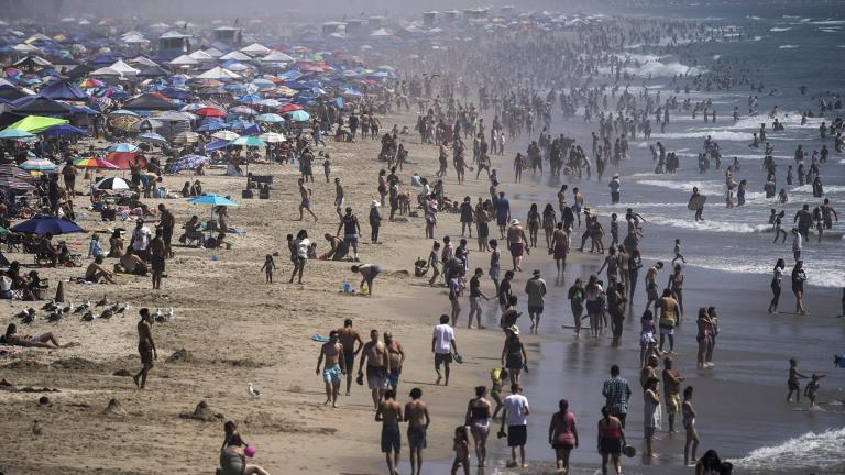 In this Saturday, Sept. 5, 2020 file photo, people crowd the beach in Huntington Beach, Calif., as the state swelters under a heat wave. (AP Photo / Jae C. Hong) In this Saturday, Sept. 5, 2020 file photo, people crowd the beach in Huntington Beach, Calif., as the state swelters under a heat wave. (AP Photo / Jae C. Hong)