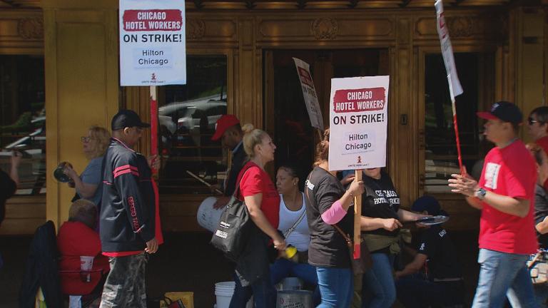 Workers picket in front of the Hilton Chicago on Tuesday, Sept. 11, 2018. (Chicago Tonight)