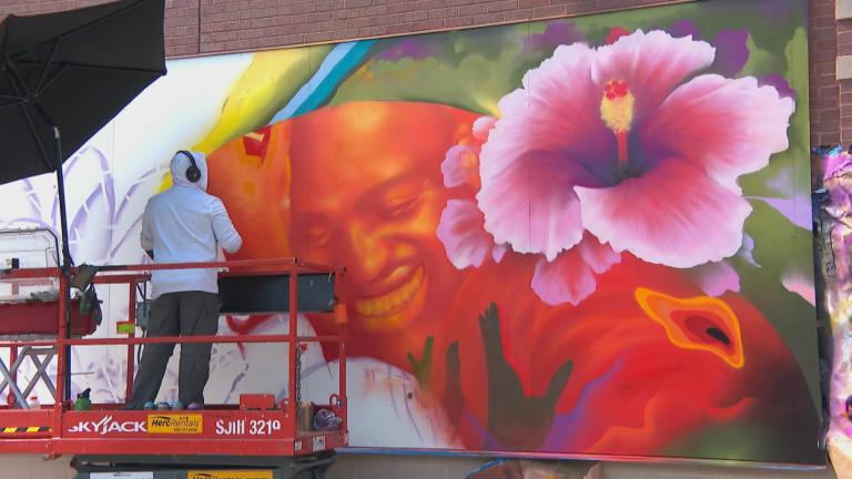 Max Sansing works on a mural paying homage to house music legend Frankie Knuckles. (WTTW News)