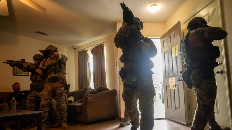 Immigration and Customs Enforcement (ICE) Special Response Team members demonstrate how the team enters a residence in the pursuit of a wanted subject at the Federal Law Enforcement Training Centers (FLETC) in Brunswick, Ga. on Thursday, Aug. 21, 2025. (AP Photo / Fran Ruchalski)