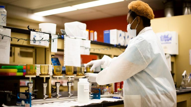 Dorothy Wright-Foulkes filters wastewater samples. (Credit: Illinois Department of Public Health)