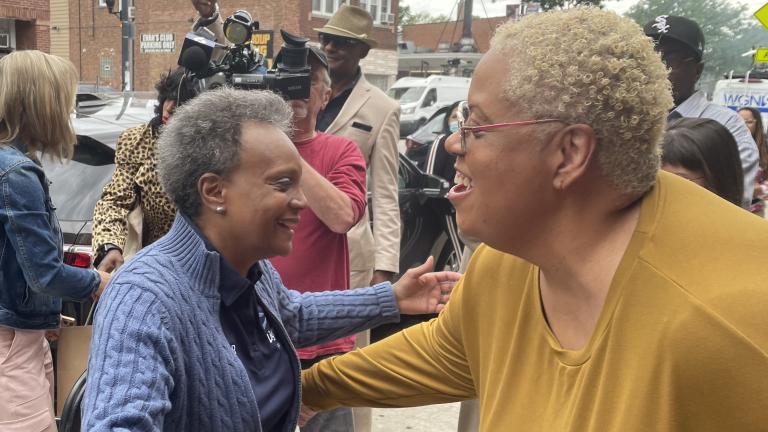 Mayor Lori Lightfoot greets Stephanie Hart, the owner of Brown Sugar Bakery, during her campaign launch, June 8, 2022. (Heather Cherone / WTTW News)