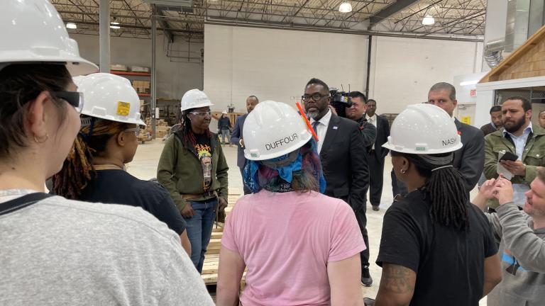 Mayor-elect Brandon Johnson speaks with trainees at the Mid-America Carpenters Union facility on Thursday, April 27. (Heather Cherone/WTTW News)