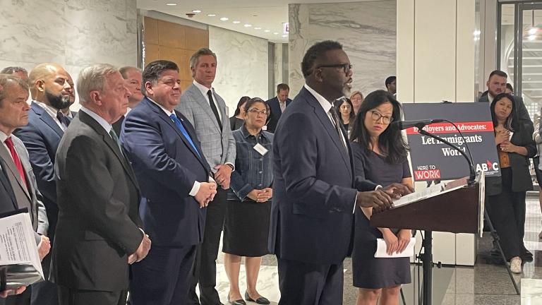 Mayor Brandon Johnson calls for President Joe Biden to allow migrants sent to Chicago from Texas to work, alongside Gov. J.B. Pritzker and U.S. Sen. Dick Durbin on Wednesday, Aug. 30, 2023. (Heather Cherone/WTTW News)