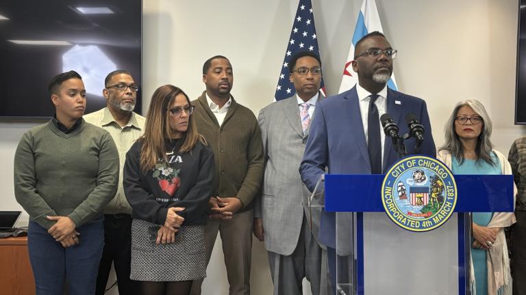 Mayor Brandon Johnson addresses the news media on Monday, Nov. 17, 2025, as Ald. Jason Ervin (28th Ward) stands behind him and alongside other allies of the mayor. (Heather Cherone / WTTW News)