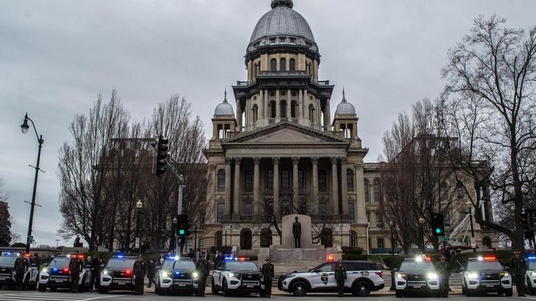 Illinois State Police squad cars are pictured in front of the Illinois State Capitol in 2022 during a 100th anniversary celebration of the agency. (Jerry Nowicki / Capitol News Illinois)