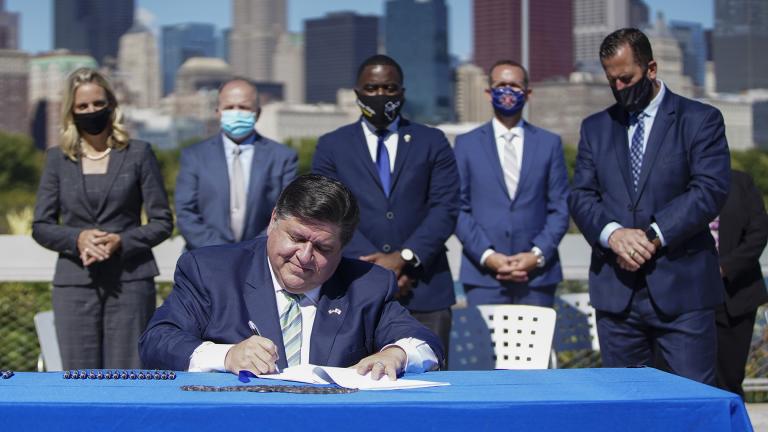 Gov. J.B. Pritzker signs the state's Climate and Equitable Jobs Act at Shedd Aquarium in Chicago on Wednesday, Sept. 15, 2021. (Anthony Vazquez / Chicago Sun-Times via AP)