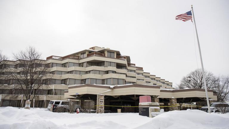 Police investigate the scene of a shooting at the Indian Lakes Hotel on Saturday, Feb. 6, 2021 in Bloomingdale, Ill. (Pat Nabong / Chicago Sun-Times via AP)