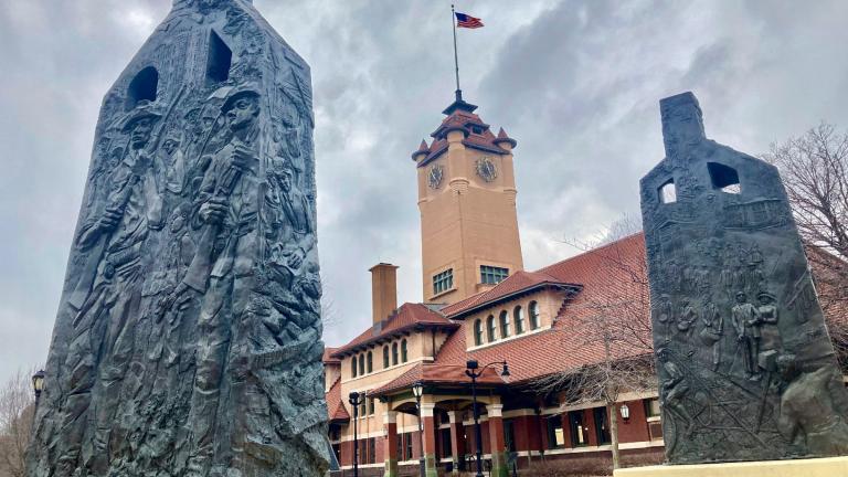FILE - Sculptures representing charred chimneys rising from the smoldering rubble of burned-out buildings make up the Centennial memorial of the 1908 Race Riot entitled, "Acts of Intolerance" by Preston Jackson, on Wednesday March 22, 2023, in Springfield, Ill. (John O'Connor / AP Photo, File)