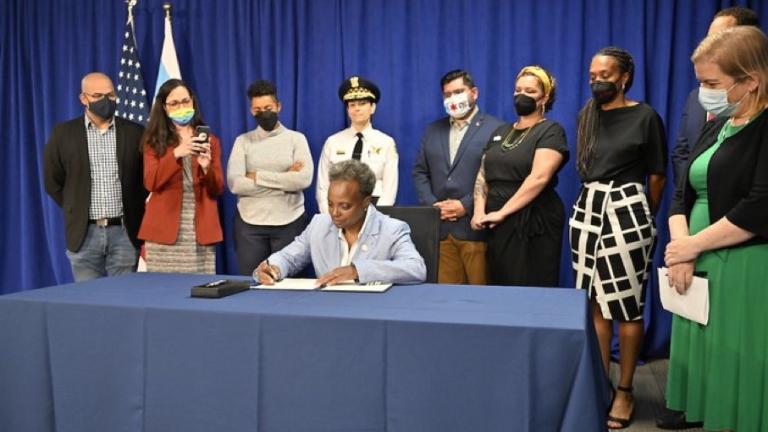 Mayor Lori Lightfoot signs an executive order Thursday, July 28, designed to protect abortion access in Chicago. (Provided: Chicago's Mayor's Office)