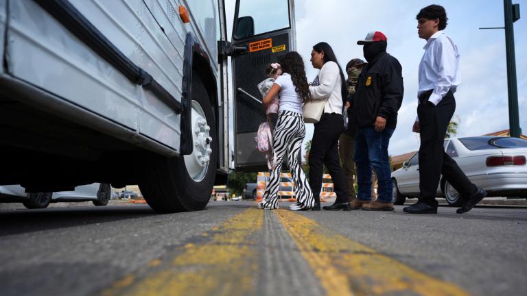 A family from Colombia is detained and escorted to a bus by federal agents following an appearance at immigration court Monday, July 14, 2025, in San Antonio. (AP Photo / Eric Gay)