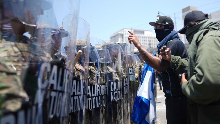 Protesters confront a line of U.S. National Guard in the metropolitan detention center of downtown Los Angeles, Sunday, June 8, 2025, following last night's immigration raid protest. (Eric Thayer / AP Photo)