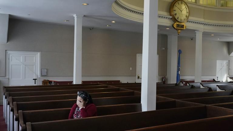 Maria Macario pauses as she talks about her family during an interview at the First Parish church, Friday, Jan. 29, 2021, in Bedford, Mass. (AP Photo/Charles Krupa)