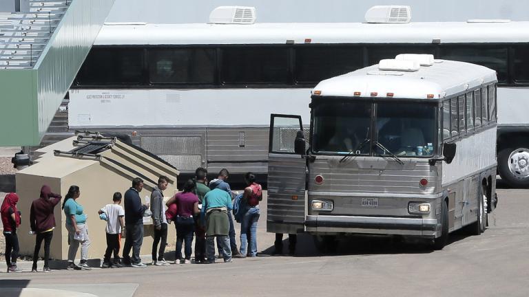 In this April 20, 2019 file photo, migrants are loaded onto a bus at the Border Patrol headquarters on Hondo Pass, in El Paso, Texas. (Mark Lambie / The El Paso Times via AP, File)