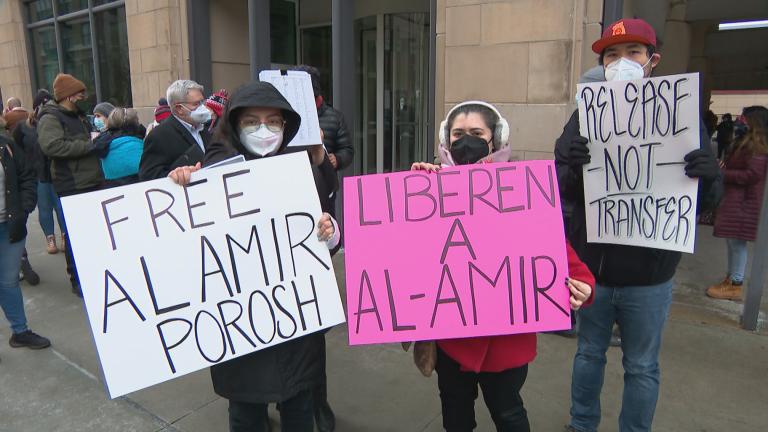 Immigrant rights activists, public health advocates, and community allies gather outside the U.S. Immigration and Customs Enforcement (ICE) Chicago Field Office Feb. 1, 2021. (WTTW News) 