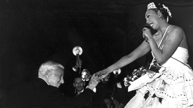 Charlie Chaplin congratulates entertainer Josephine Baker after her performance at the charity gala “Le Bal des Petits Lits Blancs,” at the Moulin Rouge in Paris, on May 20, 1953. (AP Photo, File)