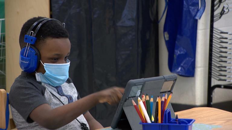 In this file photo, a young student wears a mask indoors. (WTTW News)
