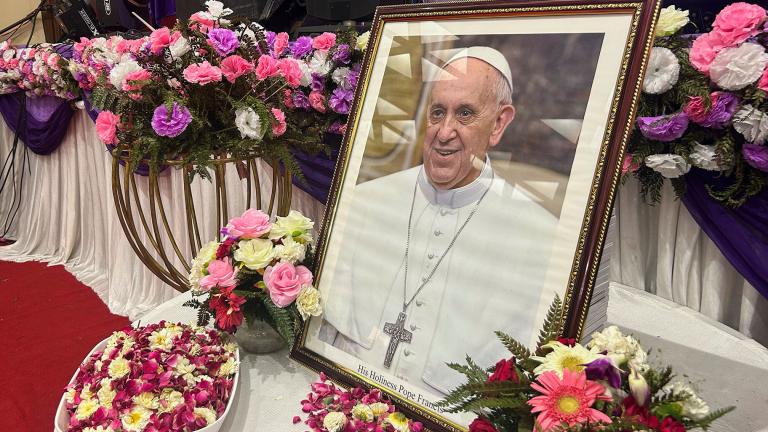 A portrait of Pope Francis is displayed for the people to offer their respects, following the announcement of his death, during a multi-faith assembly at the Sacred Heart Cathedral in New Delhi, India, Monday, April 21, 2025. (Piyush Nagpal / AP Photo)