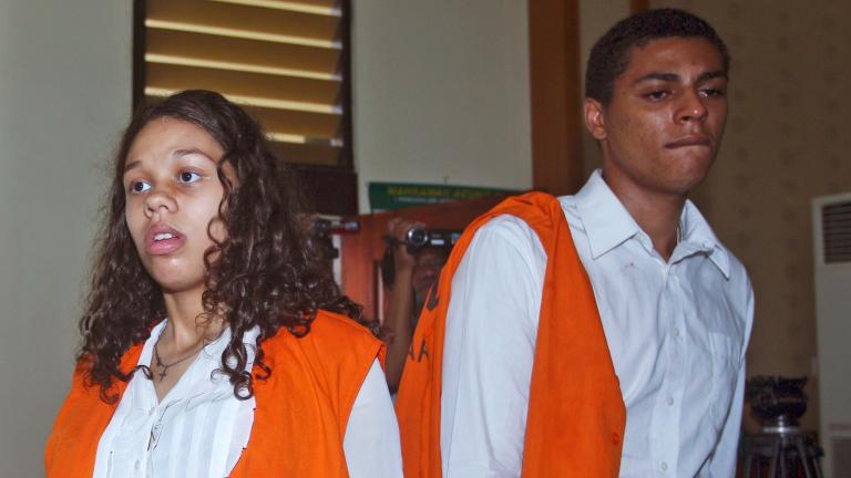 In this March 12, 2015 file photo, Heather Mack, left, and her boyfriend Tommy Schaefer, both from Chicago, Ill., who are accused of of murdering Mack's mother Sheila von Wiese-Mack whose body was later found in a suitcase, enter the court room prior to the start of their trial hearing at the district court in Denpasar, Bali, Indonesia. (AP Photo/Firdia Lisnawati, File)