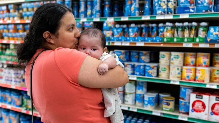 FILE - Yury Navas, 29, of Laurel, Md., kisses her two-month-old baby Jose Ismael Gálvez, at Superbest International Market in Laurel, Md., May 23, 2022, while looking for formula. (AP Photo / Jacquelyn Martin, file)