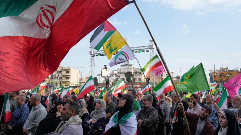A man waves a representation of the Iranian flag during a state-organised rally in Tehran, Iran, Wednesday, April 29, 2026, celebrating the birthday of Imam Reza, the 8th Shiite Muslims' Imam, and showing their support to the Iranian Supreme Leader Ayatollah Mojtaba Khamenei. (AP Photo/Vahid Salemi)