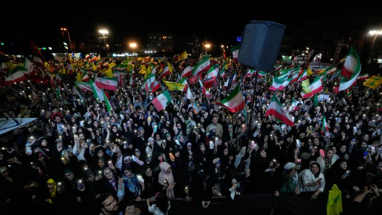 Demonstrators wave Iranian flags and flags of Lebanon's militant Hezbollah group during a pro-government gathering at Islamic Revolution Square in Tehran, Iran, Saturday, May 30, 2026. (AP Photo / Vahid Salemi)