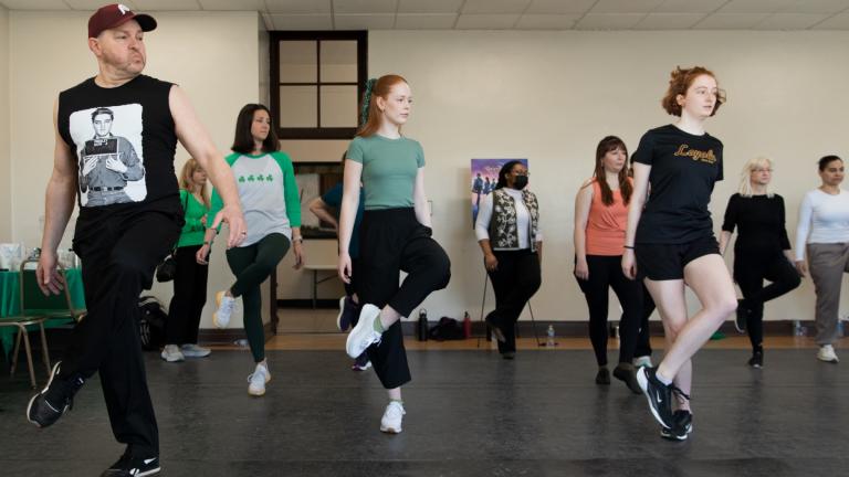 WTTW News arts reporter Marc Vitali, left, gives Irish dancing his best shot at the Irish American Heritage Center, 4626 N. Knox Ave., on March 17, 2025. (Michael Izquierdo / WTTW News)