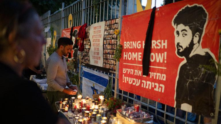 People light candles during a vigil in memory of slain hostage Hersh Goldberg-Polin in Jerusalem, Israel, Sunday, Sept. 1, 2024. (AP Photo/Leo Correa)