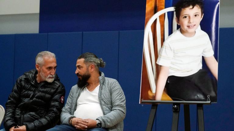 Wadee Alfayoumi's father, Oday Al Fayoume, seated right, and his uncle Mahmoud Yousef attend a vigil for Wadee at Prairie Activity and Recreation center in Plainfield, Ill., Oct. 17, 2023. (AP Photo / Nam Y. Huh, File)
