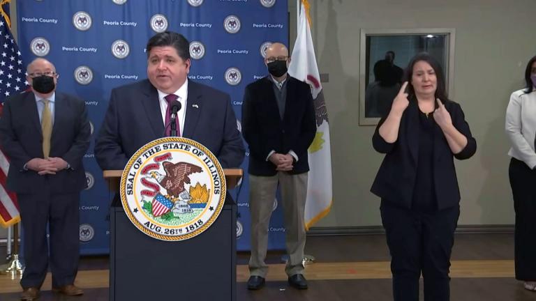 Gov. J.B. Pritzker speaks about the coronavirus at a vaccination site in Peoria on Wednesday, Feb. 24, 2021. (WTTW News)