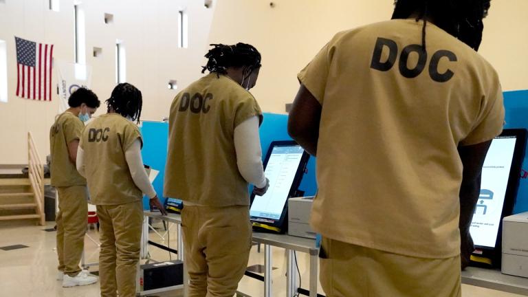 Inmates at the Cook County, Ill., jail vote in a local election at the jail's Division 11 Chapel on Saturday, Feb. 18, 2023, in Chicago. (AP Photo / Charles Rex Arbogast)