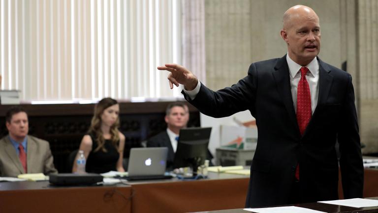 Prosecutor Joseph McMahon delivers closing statements to the jury on Thursday, Oct. 4, 2018 as Chicago police Officer Jason Van Dyke, far left, watches. (Antonio Perez / Chicago Tribune / Pool) 