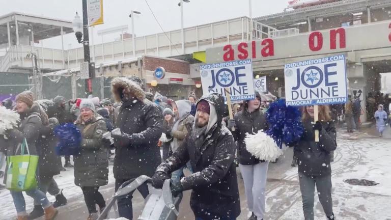 Supporters of Joe Dunne march with the Peirce Elementary School contingent during the Jan. 28, 2023, Lunar New Year parade in Uptown. (Credit: Uptown United)