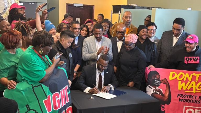 Mayor Brandon Johnson on March 25, 2026, vetoes an ordinance that would reverse a 2023 City Council vote to phase out the tipped minimum wage. (Heather Cherone / WTTW News)