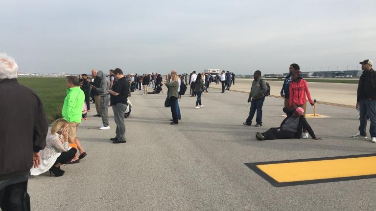 On Twitter, user Jose Castillo shared this photo and caption after American Airlines Flight 383 caught fire: "Here’s a picture my dad sent me from the runway."