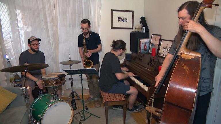 Chicago-based musician Juan Pastor, left, plays the cajon with his band Chinchano. (WTTW News)