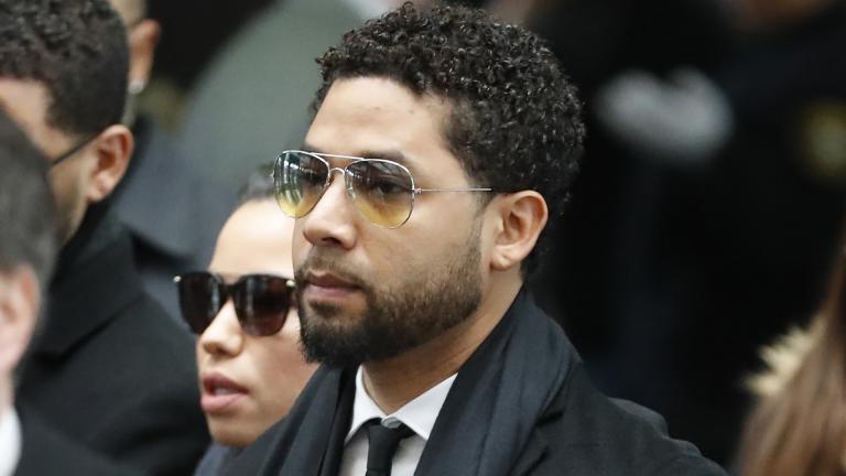 Former “Empire” actor Jussie Smollett, center, arrives for an initial court appearance Monday, Feb. 24, 2020, at the Leighton Criminal Courthouse in Chicago, on a new set of charges alleging that he lied to police about being targeted in a racist and homophobic attack in downtown Chicago early last year.  (AP Photo / Charles Rex Arbogast)