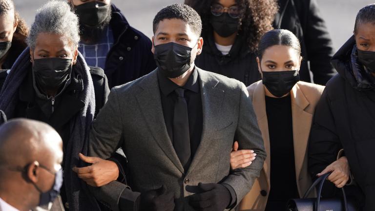 Actor Jussie Smollett, center, arrives Tuesday, Nov. 30, 2021, at the Leighton Criminal Courthouse for day two of his trial in Chicago. Smollett is accused of lying to police when he reported he was the victim of a racist, anti-gay attack in downtown Chicago nearly three years ago, in Chicago. (AP Photo/Charles Rex Arbogast)