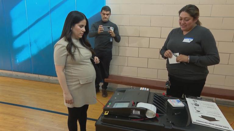 Karen Villagomez casts a ballot in Tuesday's election. (WTTW News)