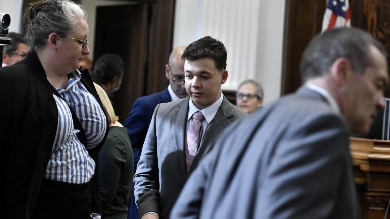 Kyle Rittenhouse, center, returns to the courtroom for the jury selection portion of his trial at the Kenosha County Courthouse in Kenosha, Wis, on Monday, Nov. 1, 2021. (Sean Krajacic/The Kenosha News via AP, Pool)