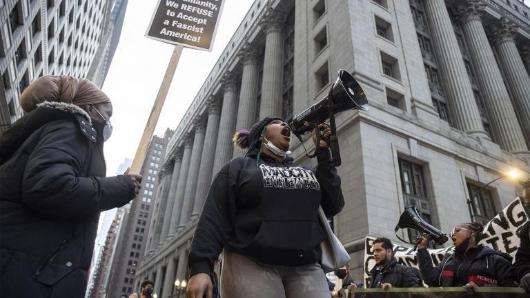 An activist chants in front of City Hall in the Loop to protest the acquittal of Kyle Rittenhouse, Saturday afternoon, Nov. 20, 2021, in Chicago. (Pat Nabong / Chicago Sun-Times via AP) 