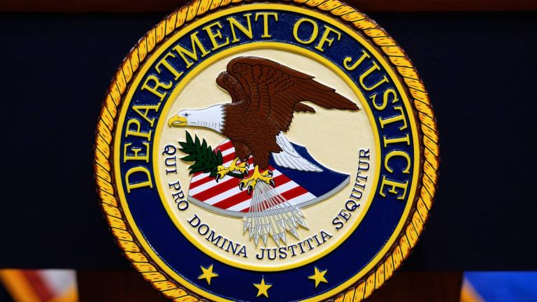 The U.S. Department of Justice logo is seen on a podium before a news conference at the Justice Department in Washington, on May 6, 2025. (AP Photo / Julia Demaree Nikhinson, File)