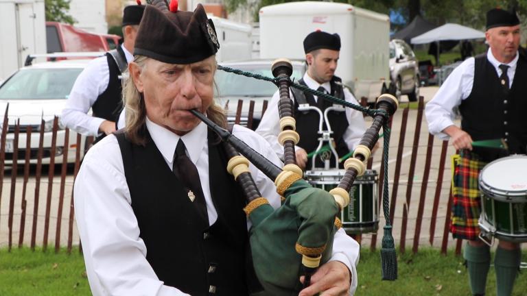 Members of the Chicago Stock Yard Kilty Band rehearse before competing at the Wisconsin Highland games in Waukesha, Wisconsin, on Aug. 31. (Evan Garcia / WTTW News)
