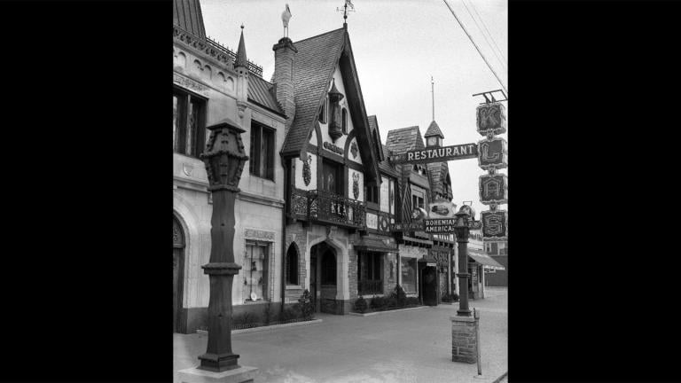 The coats of arms and flourishes like bells and statuettes on the façade of the Klas Restaurant make it feel like something you’d stumble upon in a little village in Eastern Europe. (Courtesy of Chuckman’s Collection)