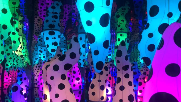 Yayoi Kusama created an installation called “Love is Calling.” It features polka dot tentacles rising up like stalagmites in an endless psychedelic cave. (Marc Vitali / WTTW News)