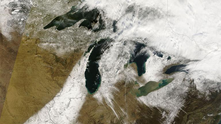 Streaks of snow stretching across the Great Lakes captured by a NASA satellite on Dec. 9, 2006. (NASA)