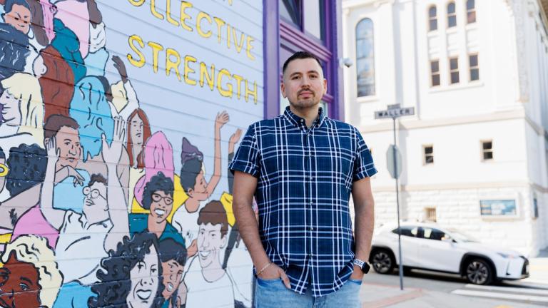 Luis A. Torres stands for a portrait in front of the " Joy is the Fuel" mural by Cuban-American artist Alma Landeta at the SF LGBT Center on Friday, Sept. 20, 2024, in San Francisco. (AP Photo / Juliana Yamada)