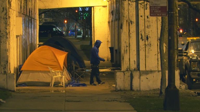 A number of tents line the Lawrence Avenue underpass on a winter night in 2016. (Chicago Tonight)