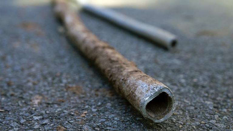 FILE - Lead water pipes pulled from underneath the street are seen in Newark, N.J., Oct. 21, 2021. Lead pipes have caused harm for decades. In recent years, residents in Newark and Benton Harbor, Mich., were forced to use bottled water for basic needs like cooking and drinking, after tests revealed elevated levels of lead. (AP Photo/Seth Wenig, File)
